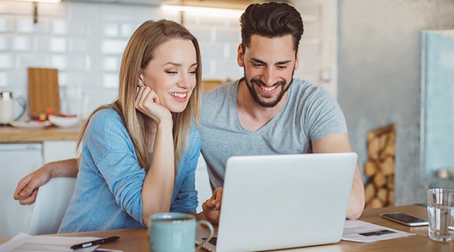 Couple paying bill online.